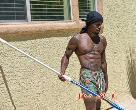 Tall brunette Sofie Marie blowing off a black muscular pool boy