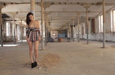Teen pornstar Penelope Cum peels in abandoned building to get some big dick