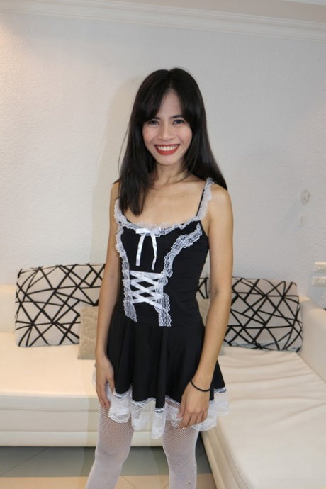 Asian maid Parawisa shows her tiny tits & her shaved cunt in the living room