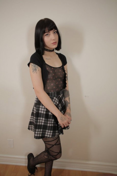Emo teen Charlotte Sartre posing in stockings and spreading her ass in solo