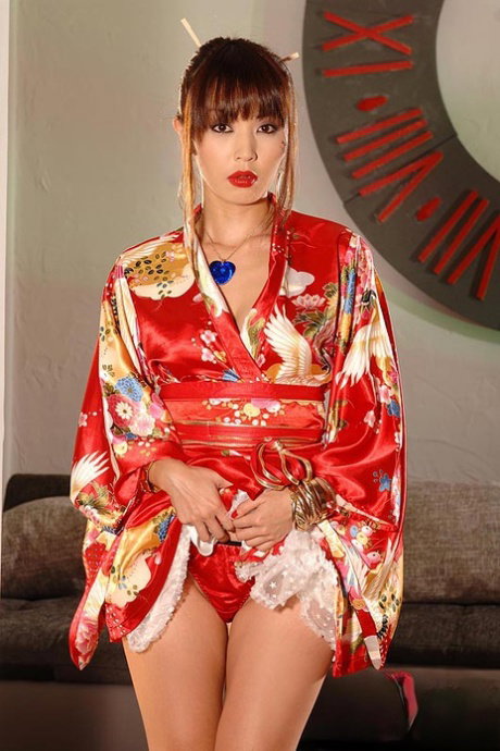 Beautiful Asian model Marica Hase hikes her kimono to finger her pussy