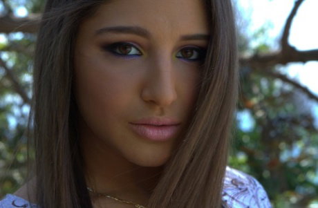 Solo girl Abella Danger shows off her big butt and twat outside summer home