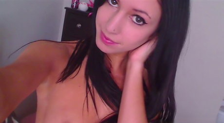 Horny teen Catie Minx takes a sex toy to her pink pussy atop her bed