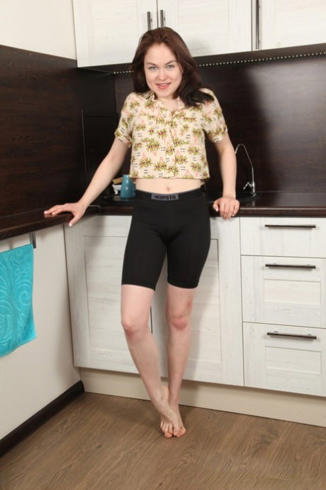 Russian housewife Maya Stone spreading her hot pink pussy in the kitchen
