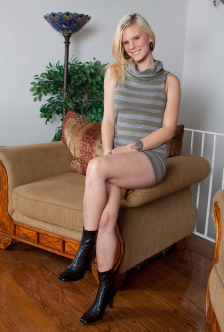 All natural blonde undresses and parts her hairy pussy lips on chair
