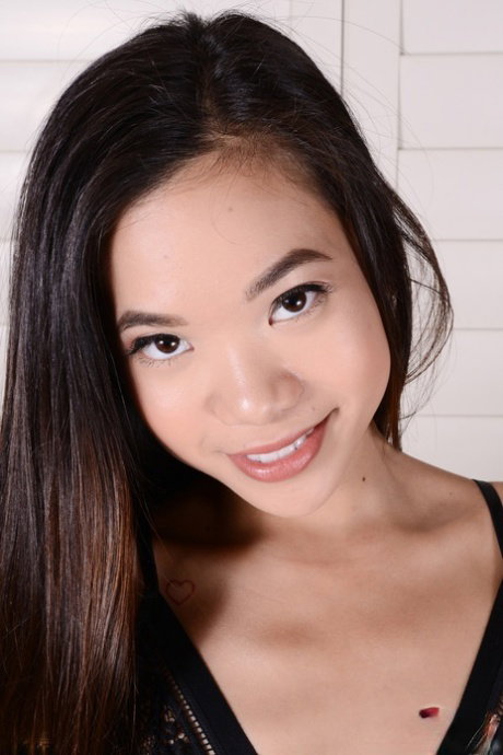 Asian teen Vina Sky spreads her pussy after removing a bodysuit