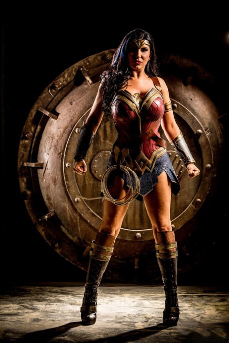 Kinky MILF in a Wonder Woman costume Romi Rain gets rammed by three dudes