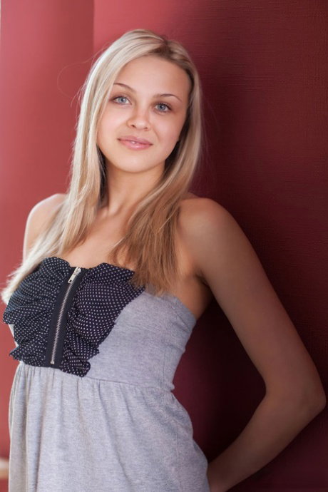 Nice blonde teen Luciana ears a peach while showing her naked beauty
