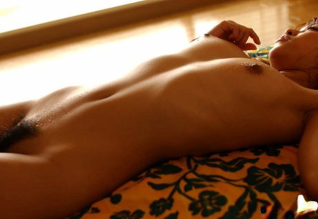 Lovely asian teen babe with sexy ass Asuka Kyono posing naked on the bed