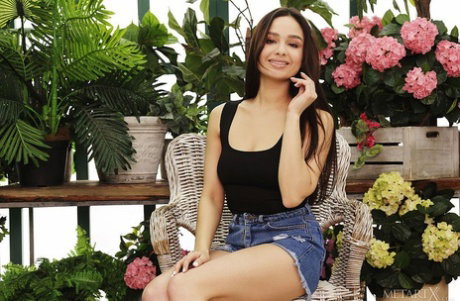 Teen model Astrid Herrara shows her bare ass while touching her pussy in heels
