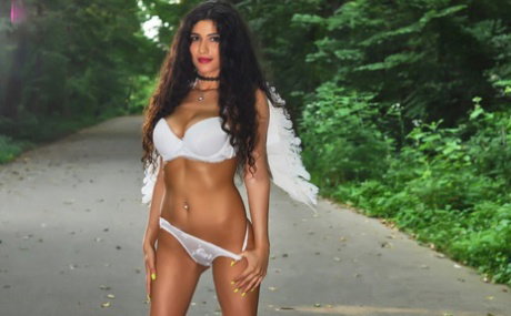 Glamorous babe Iris Blues teases in sexy lingerie & high heels outdoors
