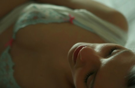 Platinum blonde teen Kira W removes her lingerie to stand naked in her bedroom