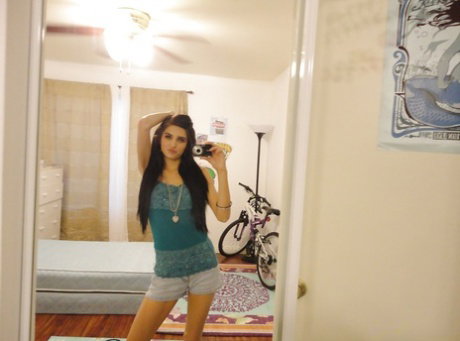 Slender female Zoey Kush ditching her shorts and top while taking selfies