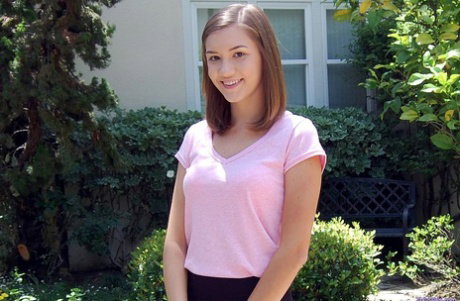Amateur beauty Riley stripping in the garden & posing in her panties