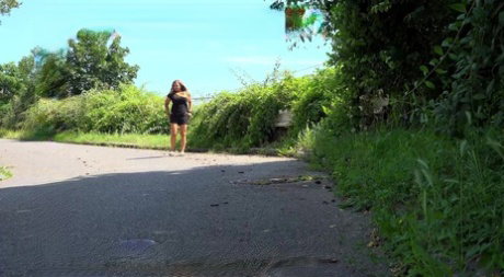 Blonde chick Jena Lovely takes a badly needed piss on a road during the day