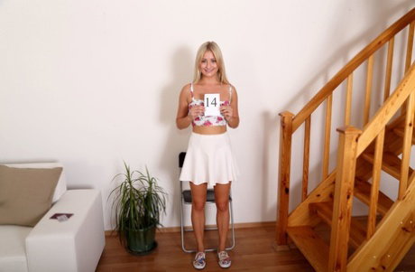Tiny blonde Cayla Lyons takes off a white dress to show her naked pussy