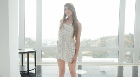 Solo girl Nina Skye lets her summer dress fall away for nude poses