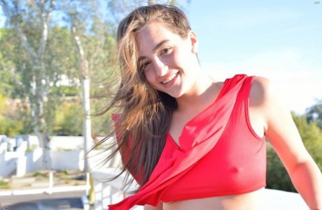 Young solo girl stretches and pleasures her horny pussy any way she can