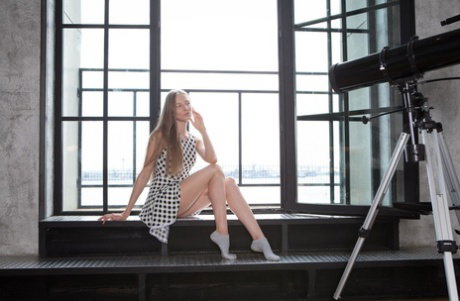 Leggy teen Nimfa B strikes great solo poses after getting naked in her bedroom