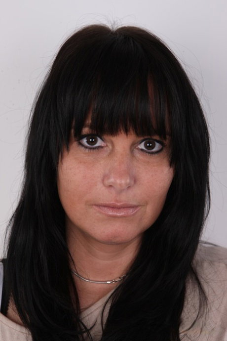 Dark-haired amateur strips to stand naked and show her big butt