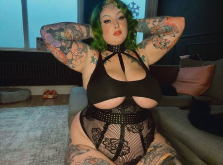 Heavily tattooed fatty Galda Lou shows off her big tits in black lingerie