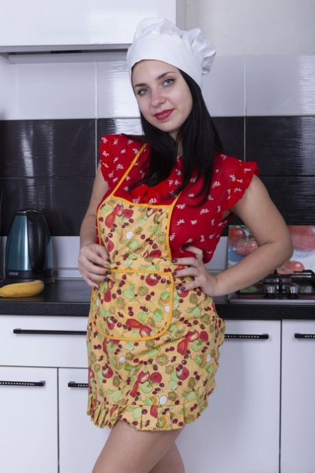 Sexy teen with natural tits Tanita flaunts her hairy pussy in the kitchen