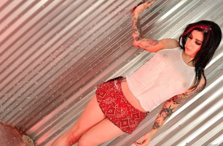 Wet chick Joanna Angel fingers her landing strip pussy in see thru tank top