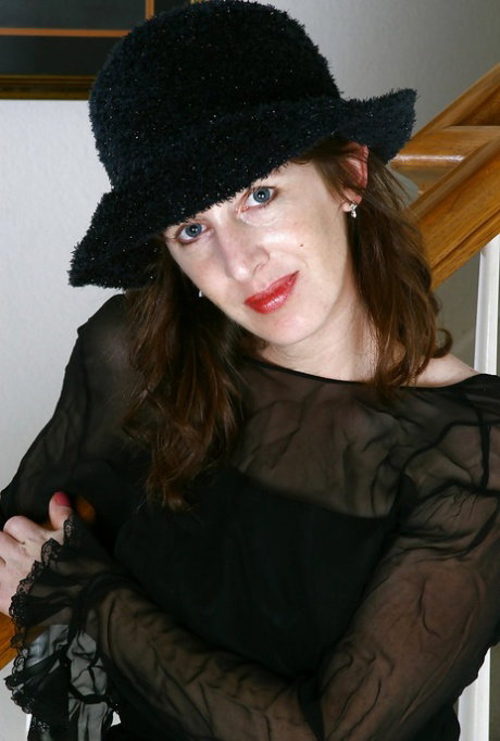 Filthy mature woman with slender legs stripping and spreading her legs