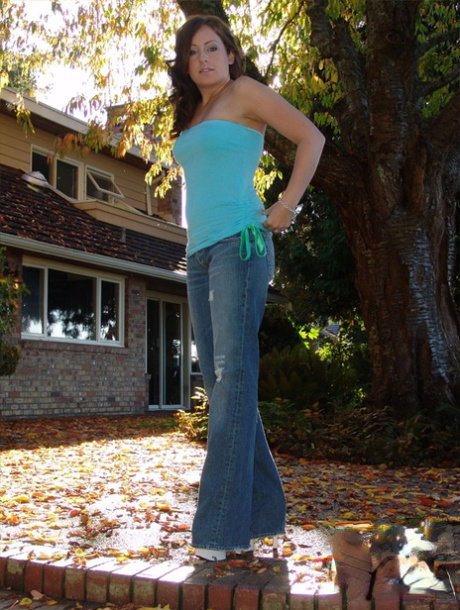 Redheaded SFW model Kylies Secret goes topless outdoors in blue jeans