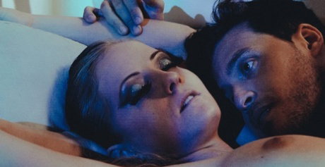 Blonde beauty Sicilia posing with her naked man at the erotic photoshoot