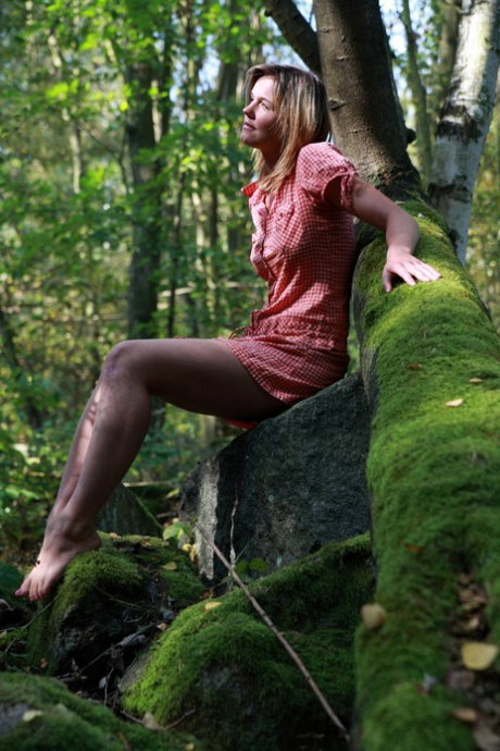 Blonde teen has sexual relations with her boyfriend in a mature forest