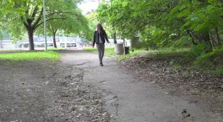 Blonde girl Victoria Pure gets caught pissing on a path through the woods