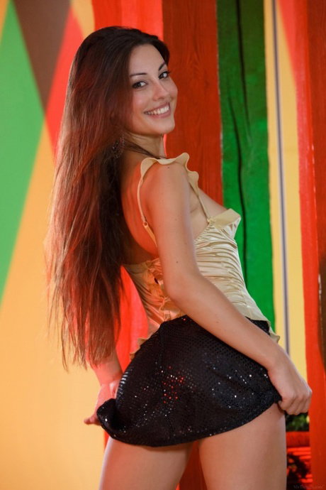 Skinny cutie Lorena Garcia strips nude and plays with a purple toy in a solo