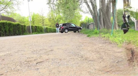 Solo girl Naomi Bennet takes a pee on a gravel roadway when caught short