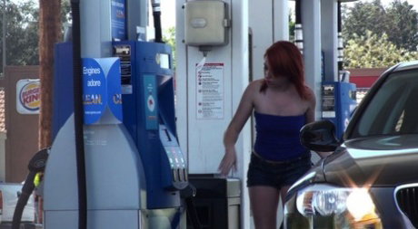 Sexy redhead with no bra gets her blouse stripped and tits exposed outdoors
