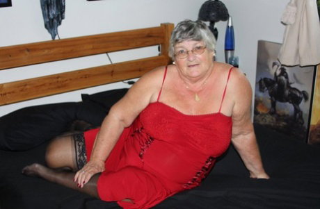 Overweight nan Grandma Libby finger fucks on a bed in lingerie and nylons