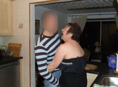 Mature plumper Kinky Carol pleasures a younger man's cock in her kitchen