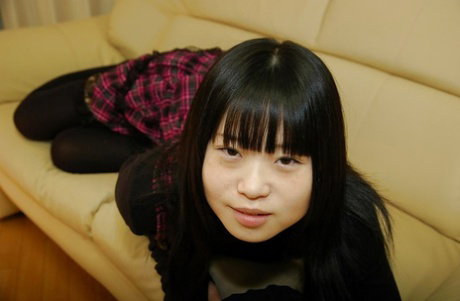 Playful asian schoolgirl Rio Takei getting rid of her clothes