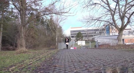 Shalina Shine holds her ass while taking a piss on a public walkway