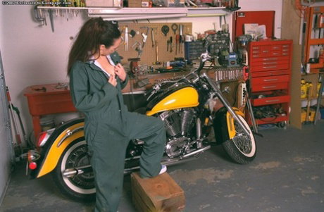 Kristyann poses topless on the bike and touches her nipples!