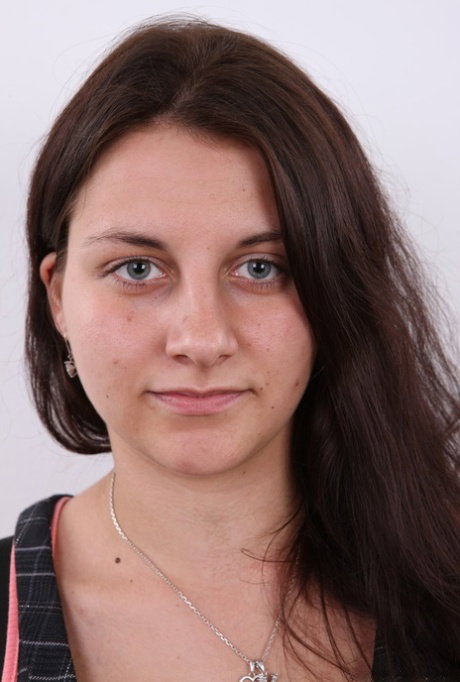 Amateur girl Katka takes a seat on a stool after removing all her clothes