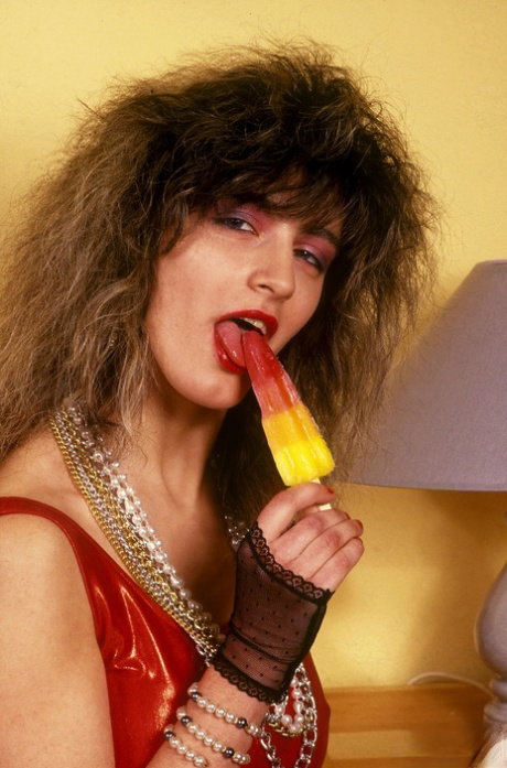 Lolly sports red lips and big hair while engaging in pussy to mouth sex