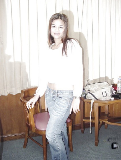 Asian brunette babe undressing and spreading her awesome pussy