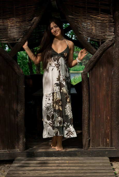 Sweet young girl with long hair strips naked on beach and in tepee as well