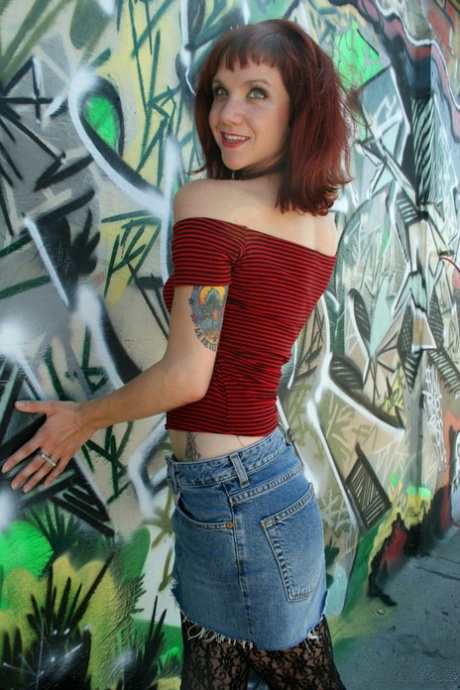 Gorgeous redhead fetish girl does public striptease spreading ass in the alley