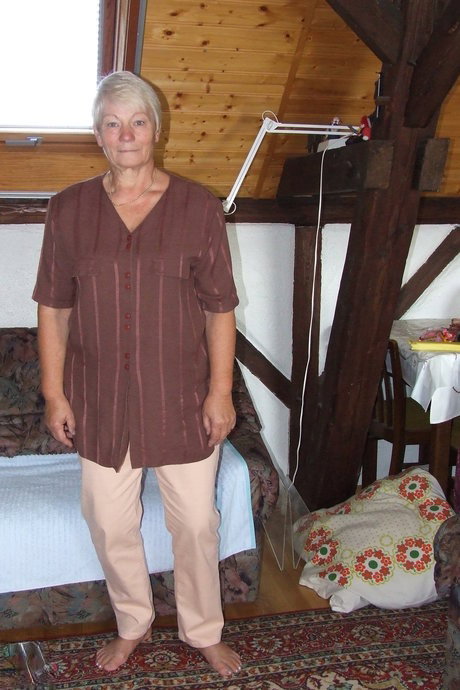 Short-haired granny Gisela strips naked and shaves her old pussy