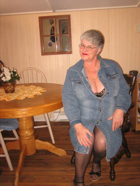 Big titted overweight granny Girdle Goddess dildos her beaver over a table