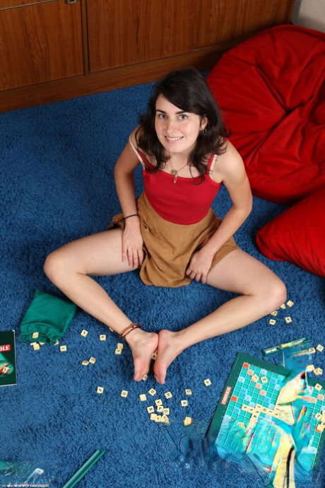 Amateur gamer girl Brigitte toys with dildo on the carpet & shows pussy juice