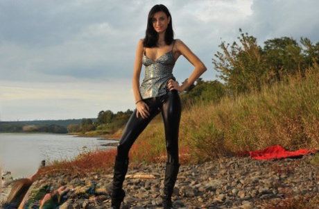 Dark haired chick Gabi de Castello rips open leather pants to show her pussy