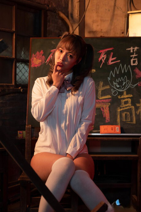 Chinese student Bad Bad has sex with her tutor in white over the knee socks